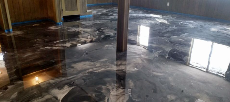 Metallic epoxy floor in a basement of Gastonia,NC. The work was done by Epoxy Floor Gastonia Pros.